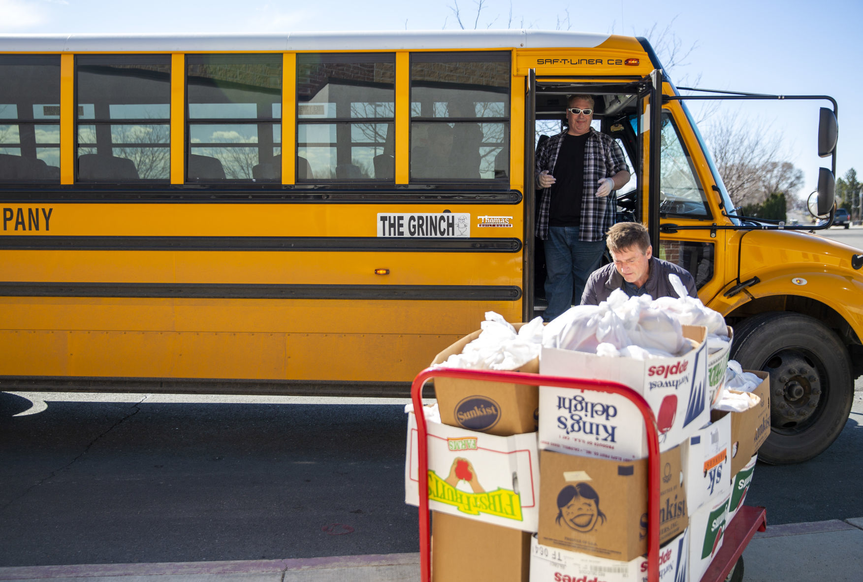 Bus drivers deliver food to students